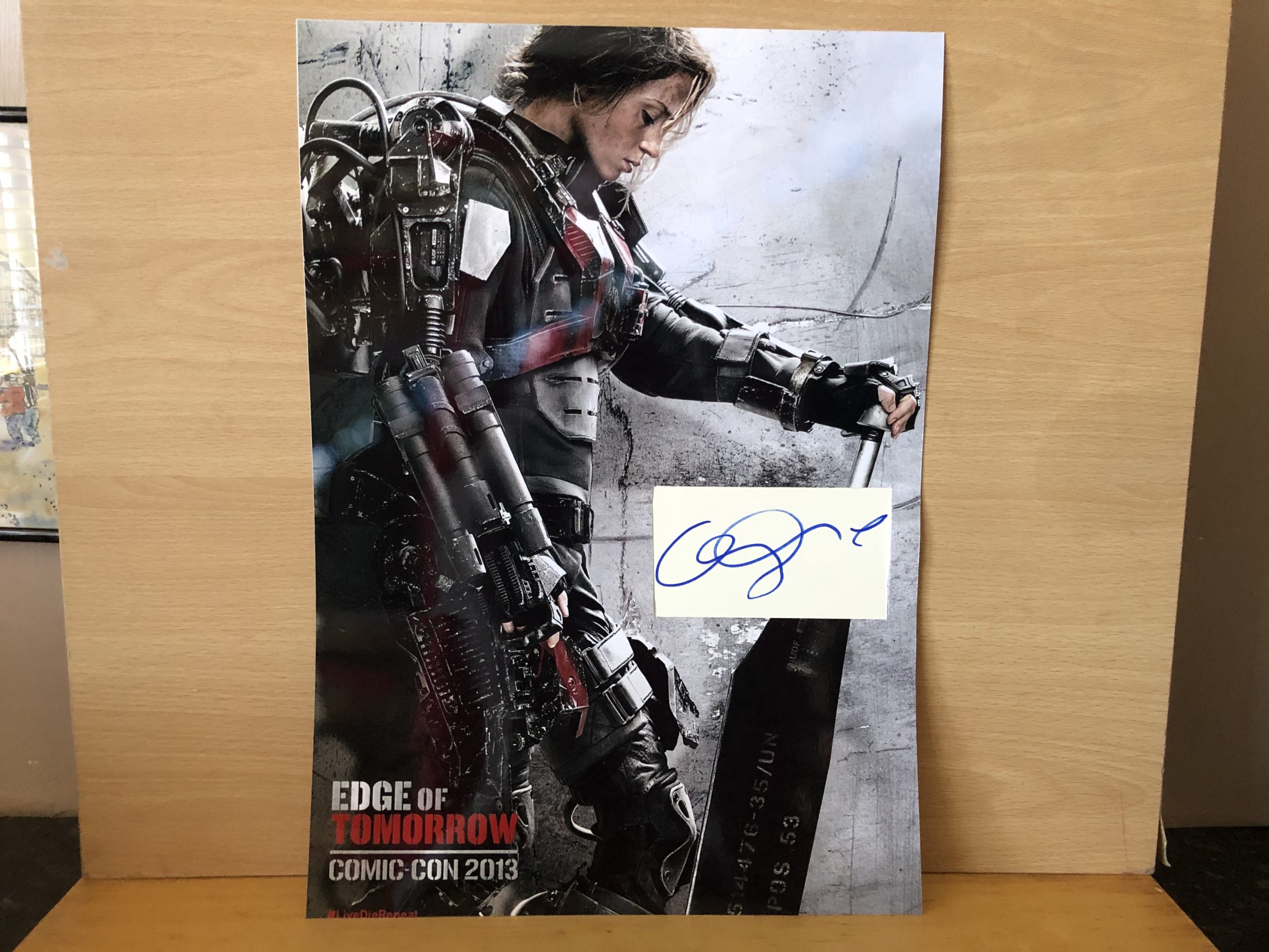Emily Blunt Signed White Card within A3 Colour Photo Emily Blunt Signed White Card within A3 Colour Photo
